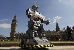 A robot is pictured in front of the Houses of Parliament and Westminster Abbey as part of the Campaign to Stop Killer Robots in London April 23, 2013.