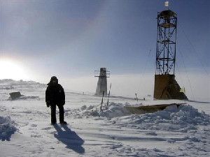 A man stands near drilling apparatus at the Vostock research camp in Antarctica in this January 13, 2006 handout photograph.