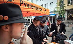 Pirate Party members on the campaign trail in Dusseldorf. The group has built its success on little more than a vague platform of greater openness in government, using technology.