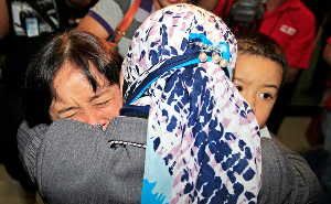 A relative of one of the passengers on board the missing Sukhoi Superjet 100 aircraft was comforted after checking the passenger list at Halim Perdanakusuma Airport in Jakarta, Indonesia, on Wednesday.