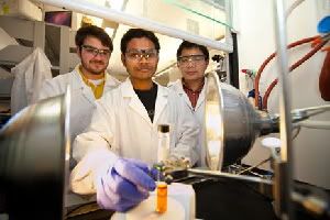 Ryan Spencer Shinabery, Soumitra Maity and Nan Zheng (from left) have created a new, “green” method for developing medicines. (Not shown: Mingzhao Zhu.) (Credit: Image courtesy of University of Arkansas, Fayetteville)