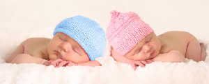 Newborn baby boy and girl. Scientists are beginning to understand one of life's enduring mysteries -- why women live, on average, longer than men. (Credit: (c) Barbara Helgason / Fotolia)