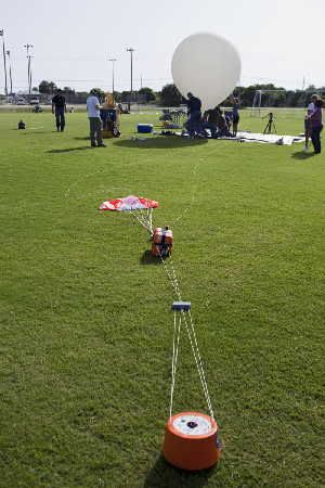 The rig set up by Rocket University linking a high-altitude balloon with a mechanism to carry and then release an aerodynamic capsule for an evaluation of its handling characteristics. (Credit: NASA/Jim Grossmann)
