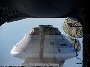 A mockup Orion capsule is poised to drop from a plane 25,000 feet above the U.S. Army Yuma Proving Ground in Arizona to test the parachute design for the spacecraft that will take humans farther than they’ve ever been before – and return them to Earth at greater speeds than ever before. (Credit: NASA)