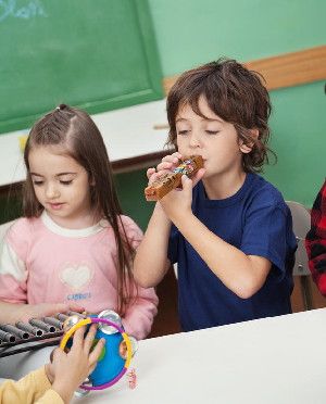 Making music can improve both pro-social behaviour (voluntary behaviour intended to benefit another) and the problem solving skills of young children according to a new study. (Credit: (c) Tyler Olson / Fotolia)