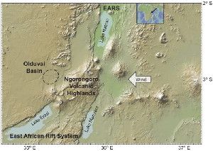 Insert shows with arrow the location of study area in eastern Africa. Map of the Northern Tanzanian Divergence Zone depicts the East African Rift System (EARS), containing Lake Natron (north), diverging around the Ngorongoro Volcanic Highland massif and splitting into two separate rift valleys (Lake Eyasi on west) and Lake Manyara (on east). Prevailing wind is from the east. Olduvai basin lies to the west of and in the rain shadow of Ngorongoro.