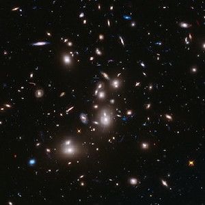 This long-exposure Hubble Space Telescope image of massive galaxy cluster Abell 2744 is the deepest ever made of any cluster of galaxies. It shows some of the faintest and youngest galaxies ever detected in space. Abell 2744, located in the constellation Sculptor, appears in the foreground of this image. It contains several hundred galaxies as they looked 3.5 billion years ago.