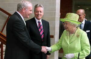 Queen Elizabeth II shook hands with Martin McGuinness, Northern Ireland's deputy first minister and a onetime commander of the Irish Republican Army, on Wednesday in Belfast.
