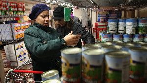 Harlem residents choose free groceries at the Food Bank For New York City in December.