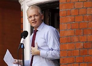 This Aug. 19, 2012 file photo shows WikiLeaks founder Julian Assange making a statement to the media and supporters at a window of Ecuadorian Embassy in central London. A news website says Assange regards his bid to become an Australian senator as a defense against potential criminal prosecution in the United States and Britain. He spoke to The Conversation website at the Ecuadorian Embassy in London where he was granted asylum in June to avoid extradition to Sweden on sex crime allegations. (AP Photo/Sang Tan, File)