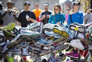 Running shoes are part of a makeshift memorial in Copely Square honoring victims of the Boston Marathon bombing. (Robert F. Bukaty / Associated Press)
