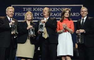 Caroline Kennedy, second from right, applauds as the recipients of the 2012 John F. Kennedy Profile in Courage Awards hold their lanterns at the JFK Library in Boston, Monday, May 7, 2012. From left are Michael Streit, former Iowa Supreme Court Justice; Marsha Ternus, former Iowa Supreme Court Chief Justice; David Baker, former Iowa Supreme Court Justice; and Robert Ford, U.S. Ambassador to Syria.
