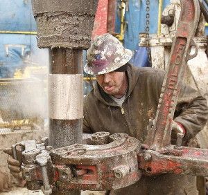 Deckhands on a Sandridge Energy oil rig change out a drill pipe in a fracking operation on the Oklahoma border in Harper County, Kan., in February 2012. A 3.8-magnitude quake in the area on December 16, 2013, rattled windows, cracked walls and shook furniture.