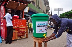 A man washes his hands as part of a campaign to prevent the spread of the Ebola virus in Monrovia, Liberia.