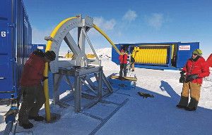 Technicians guide a hot-water drill down a borehole into the ice above Lake Ellsworth. The project was halted when two such boreholes could not be connected properly 300 meters deep.