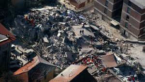 April 6, 2009: An aerial photo provided by the Italian Police shows the debris of a collapsed building in an area near L'Aquila, central Italy, after a powerful earthquake shook central Italy. (AP Photo/Italian Police)