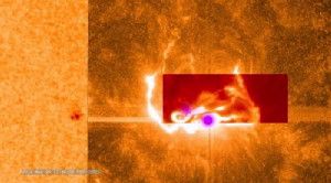 This combined image shows the March 29, 2014, X-class flare as seen through the eyes of different observatories. SDO is on the bottom/left, which helps show the position of the flare on the sun. The darker orange square is IRIS data. The red rectangular inset is from Sacramento Peak. The violet spots show the flare's footpoints from RHESSI.