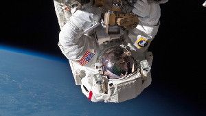 Astronaut Chris Cassidy performs a space walk to inspect and replace a pump controller box on the International Space Station after an ammonia coolant leak was discovered in May, 2013. (AP Photo/NASA)