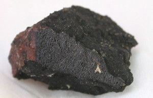 Chemical analyses of Sutter's Mill meteorite fragments (one shown) suggest that space rocks hold the molecules necessary for life to develop.