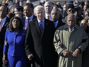 Vice President Joe Biden, center, leads a group across the Edmund Pettus Bridge in Selma, Ala., Sunday, March 3, 2013. They were commemorating the 48th anniversary of Bloody Sunday, when police officers beat marchers when they crossed the bridge on a march from Selma to Montgomery. From left: Selma Mayor George Evans, U.S. Rep. Terri Sewell, D-Ala., Rev. Jesse Jackson, Biden, Rev. Al Sharpton and U.S. Rep. John Lewis, D-Ga. (AP Photo/Dave Martin)