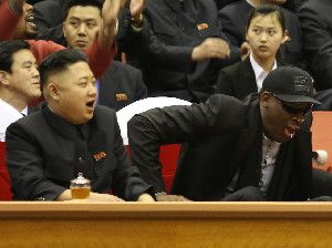 Kim Jong Un and Dennis Rodman watch North Korean and U.S. players in an exhibition basketball game at an arena in Pyongyang on Thursday.