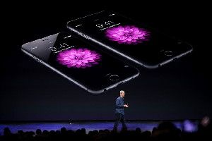 Tim Cook reveals the iPhone 6 and 6 Plus at Apple’s Sept. 9 event. Alex Washburn/WIRED
