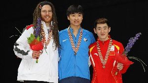 American short track speedskater Simon Cho (center) admitted last October that he sabotaged the skate blade of Canadian athlete Olivier Jean (left). The two are pictured here in 2011, at a different event.