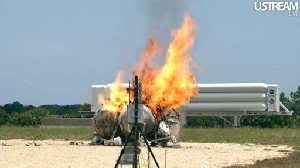 In this still image made from video provided by NASA, the methane-powered Morpheus lander burns after it crashed in a test flight at Kennedy Space Center in Florida Thursday, Aug. 9, 2012. NASA spokeswoman Lisa Malone says nobody was hurt, but it appears the prototype lander is a total loss. (AP Photo/NASA)