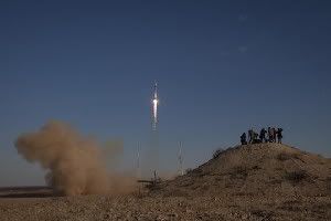 In this photo provided by NASA, members of the media photograph the Russian Soyuz rocket as it launches with Expedition 33/34 crew members, Soyuz Commander Oleg Novitskiy, Flight Engineer Kevin Ford of NASA, and Flight Engineer Evgeny Tarelkin of ROSCOSMOS to the International Space Station on Tuesday, Oct. 23, 2012, in Baikonur, Kazakhstan. Ford, Novitskiy and Tarelkin will be on a five-month mission aboard the International Space Station. (AP Photo/NASA,Bill Ingalls)