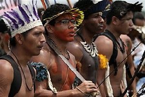 Indian men from various tribes protest in defense of the Guarani-Kaiowa tribe who are involved in a land dispute in Brasilia, Brazil, Wednesday, Oct. 31, 2012. A court has ordered the Guarani-Kaiowa Indians to surrender their territories in the western state of Mato Grosso do Sul to landowners who claim it as theirs. The indigenous community of about 170 members is asking for the demarcation of their land's borders and say they will fight for the right to their lands. (AP Photo/Eraldo Peres) Close