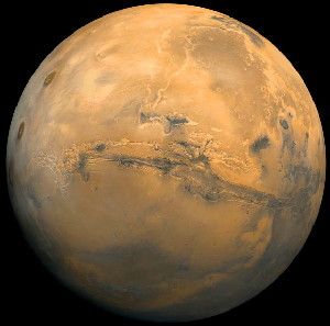 Mars; the center of the scene shows the entire Valles Marineris canyon system. Image credit: NASA Goddard Space Flight Center.