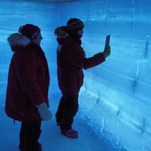 Bugs in the ice sheets: Dr. Julie Palais (left), NSF-OPP Glaciology Program Manager, and Anais Orsi (right) inside a back-lit snow pit at WAIS Divide