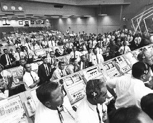 Inside the Launch Control Center, personnel watch as the Saturn V rocket carrying the Apollo 11 astronauts lifts off the launch pad on July 16, 1969. Image: NASA