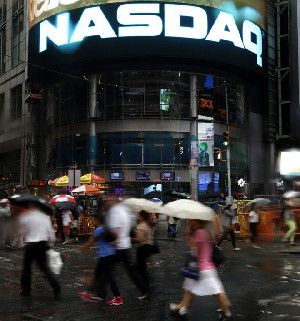 The Nasdaq logo is displayed on its building in New York, Thursday, Aug. 22, 2013. Nasdaq halted trading Thursday because of a technical problem, the latest glitch to affect the stock market. Photo: Seth Wenig / AP
