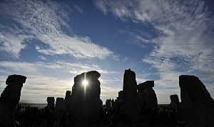 The sun rises behind Stonehenge. Ancient legends of thunder gods can be explained today with the modern science of sound waves, said a US scientist on Thursday who believes an auditory illusion inspired the creation of Stonehenge