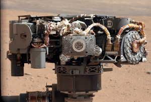 Image Caption: This image shows the Alpha Particle X-Ray Spectrometer (APXS) on NASA's Curiosity rover, with the Martian landscape in the background. The image was taken by Curiosity's Mast Camera on the 32nd Martian day, or sol, of operations on the surface (Sept. 7, 2012, PDT or Sept. 8, 2012, UTC). APXS can be seen in the middle of the picture. This image let researchers know that the APXS instrument had not become caked with dust during Curiosity's dusty landing. Scientists enhanced the color in this version to show the Martian scene as it would appear under the lighting conditions we have on Earth, which helps in analyzing the terrain. Image credit: NASA/JPL-Caltech/MSSS