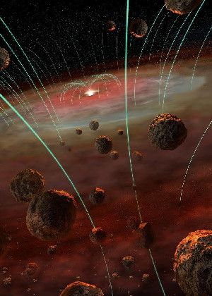 Magnetic field lines (green) weave through the cloud of dusty gas surrounding the newborn Sun. In the foreground are asteroids and chondrules, the building blocks of chondritic meteorites. While solar magnetic fields dominate the region near the Sun, out where the asteroids orbit, chondrules preserve a record of varying local magnetic fields.