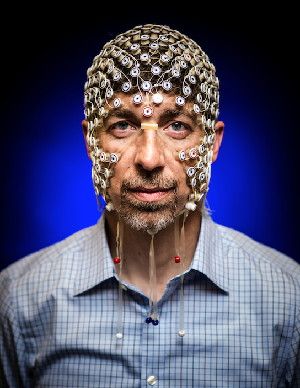 Electrical and computer engineering Professor Barry Van Veen wears an electrode net used to monitor brain activity via EEG signals. His research could help untangle what happens in the brain during sleep and dreaming.