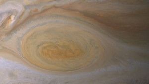 Research suggests effects of sunlight produce the color of Jupiter's Great Red Spot. The feature's clouds are much higher than those elsewhere on the planet, and its vortex nature confines the reddish particles once they form. Image credit: NASA/JPL-Caltech/ Space Science Institute 