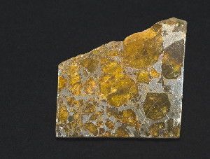 Slice of Pallasite meteorite, Belarus, 1810. 4cm across.