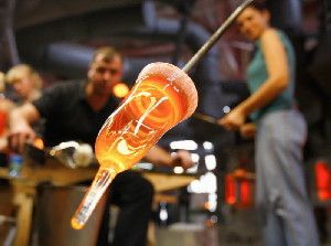 Does glass ever stop flowing? Watching a glass blower at work we can clearly see the liquid nature of hot glass. Once the glass has cooled down to room temperature though, it has become solid and we can pour wine in it or make window panes out of it.