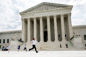 Members of the media run across the plaza at the Supreme Court holding decisions on June 25, 2015, in an official tradition referred to as the 'running of the interns.'