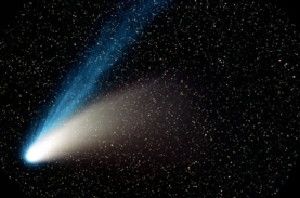 A mysterious star may have comets of its own, similar to the comet Hale-Bopp around the sun, pictured here