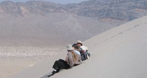 BOOM CREW  Sliding down Eureka Dunes in Death Valley National Park, Nathalie Vriend and colleagues generate a mini avalanche to record the sound waves.
