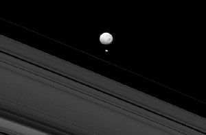 Saturn's moons Mimas and Pandora as seen by the NASA Cassini Solstice mission.