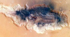 New images of Hebes Chasma (shown) from the European Space Agency’s Mars Express spacecraft suggest that massive landslides may have shaped the huge trough.