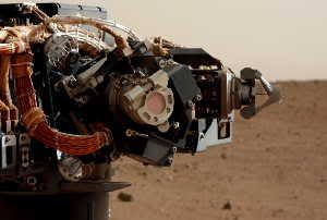 Image Caption: Camera on Curiosity's arm as seen by camera on mast. Credit: NASA/JPL-Caltech/MSSS