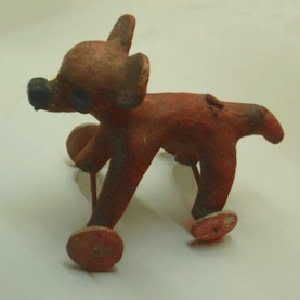 WHEELS OF WONDER: A wheeled figurine from the New World, probably made in Veracruz between 100 B.C. and 800 A.D.